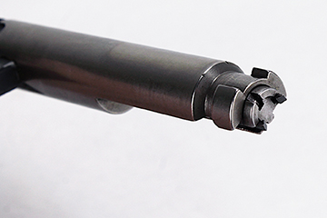 A “bolt within a bolt,” the inner portion does not rotate, while the outer sleeve features two beefy locking lugs.